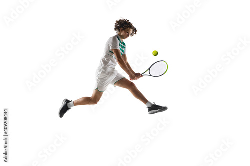 Flying. Young caucasian professional sportsman playing tennis isolated on white background. Training, practicing in motion, action. Power and energy. Movement, ad, sport, healthy lifestyle concept. © master1305