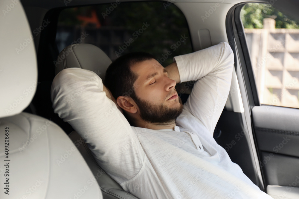 Tired man sleeping in his modern car Tired man sleeping in his modern car