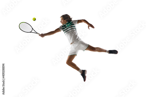 Flying. Young caucasian professional sportsman playing tennis isolated on white background. Training, practicing in motion, action. Power and energy. Movement, ad, sport, healthy lifestyle concept.