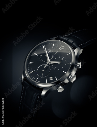 Close up view of automatic watch on black background with leather belt

