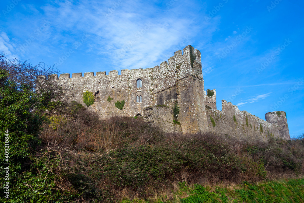 Manorbier Castle in Pembrokeshire south Wales UK which is an 11th century Norman fort ruin and a popular travel destination tourist attraction landmark, stock photo image