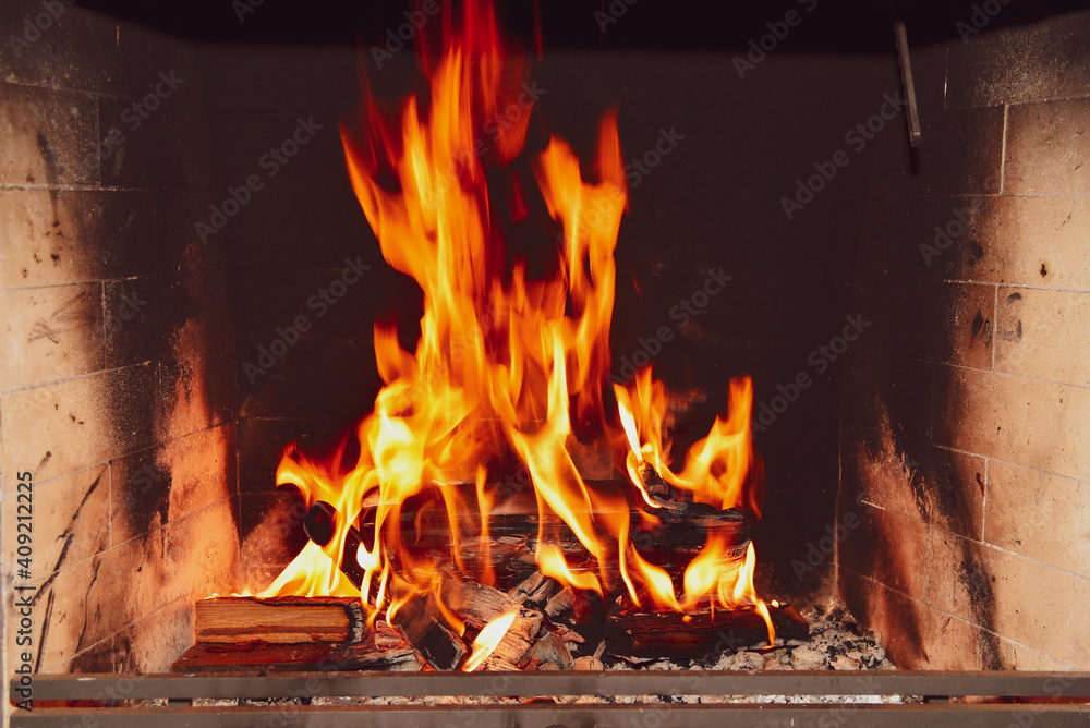 Blazing fire in fireplace.