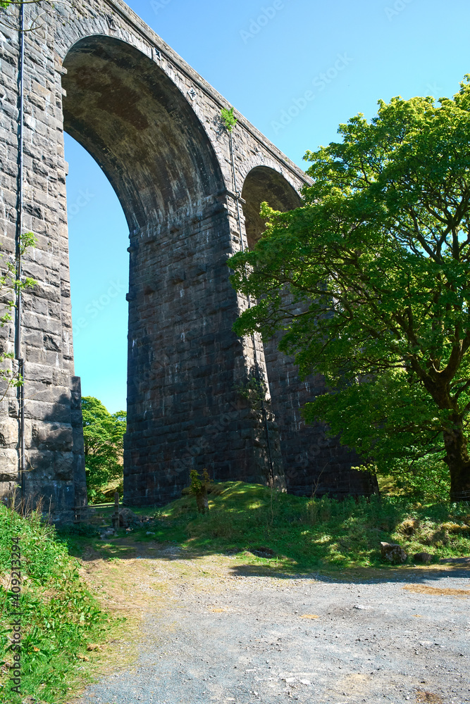An archway of an old stone built Victorian railway viaduct