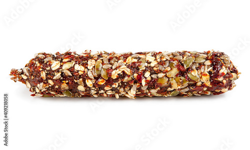 Salami sprinkled with muesli isolated on a white background. View from another angle in the portfolio.