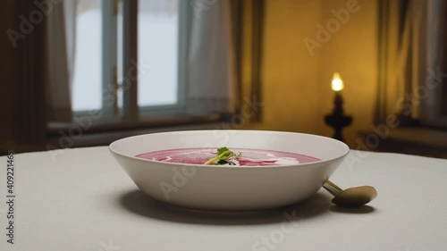 Wallpaper Mural Close up plate of ready-made beet cream soup in restaurant. Camera flying around the table. Rotation Torontodigital.ca