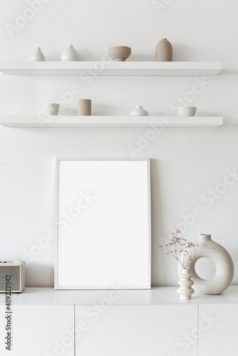 Photography Blank picture frame mockup on white wall