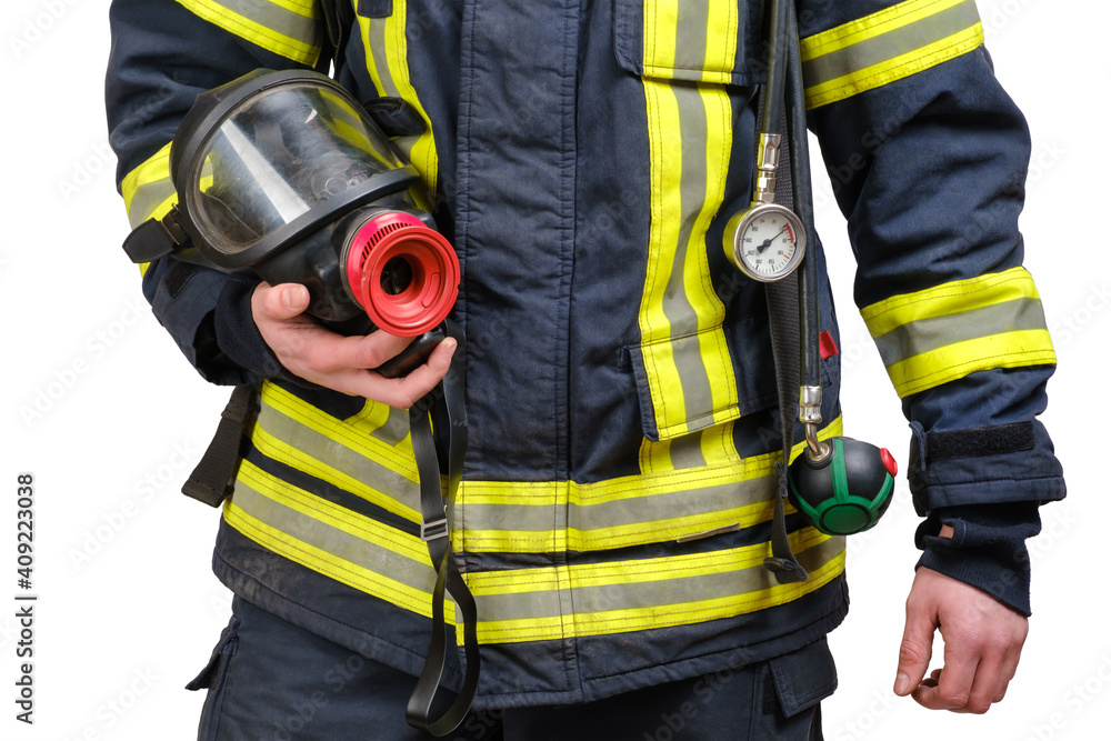 Full facepiece respirator in hand of unrecognized firefighter, rescue and fire fighter equipment isolated on white background Full facepiece respirator in hand of unrecognized firefighter, rescue and fire fighter equipment isolated on white background
