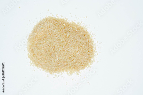 Brown sugar on white background. Copy space