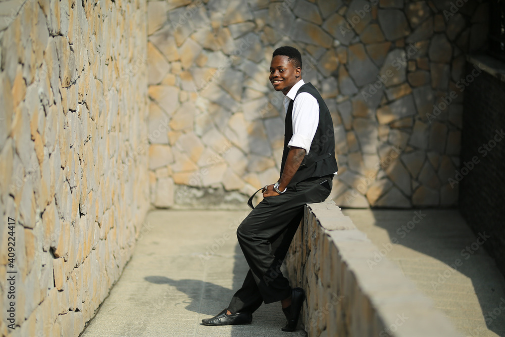 Portrait of young handsome afro black man posing outdoor. Portrait of young handsome afro black man posing outdoor.