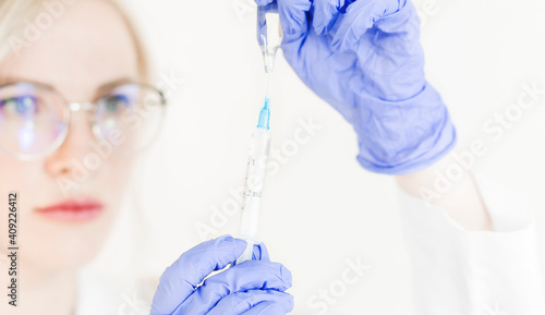 injecting injection vaccine vaccination medicine doctor insulin health drug influenza concept - stock image