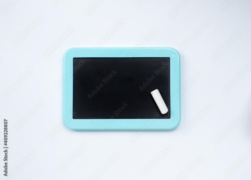 white chalk and black board for drawing and text with blue edges on a white background white chalk and black board for drawing and text with blue edges on a white background