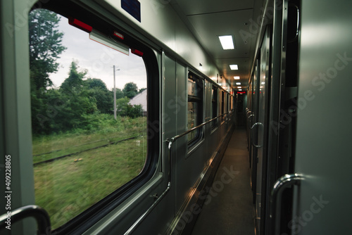 Interior of a corridor of a compartment train. Railway travel concept. © bodnarphoto