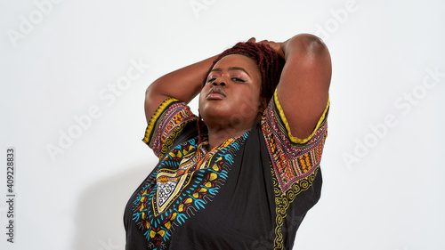 Photography Plump young haitian woman with proudly raised head
