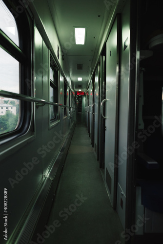 Vertical photo of the corridor of a compartment train. Railway concept. Traveling by train.