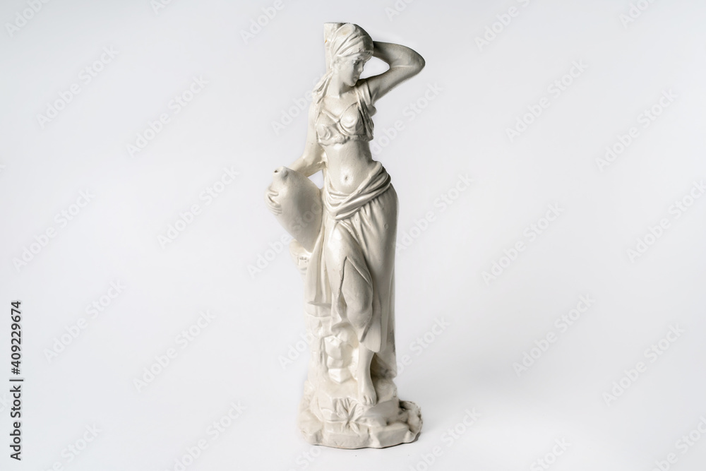 White tabletop ancient statue of a woman on a white isolated background White tabletop ancient statue of a woman on a white isolated background