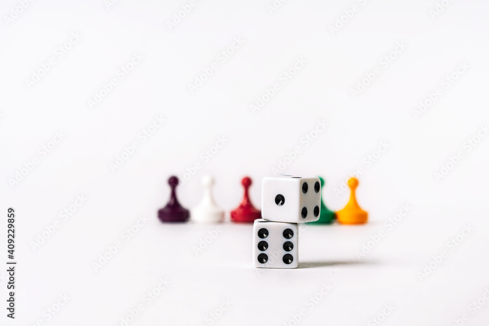 Fototapeta premium Colored playing chips and dice on a white background