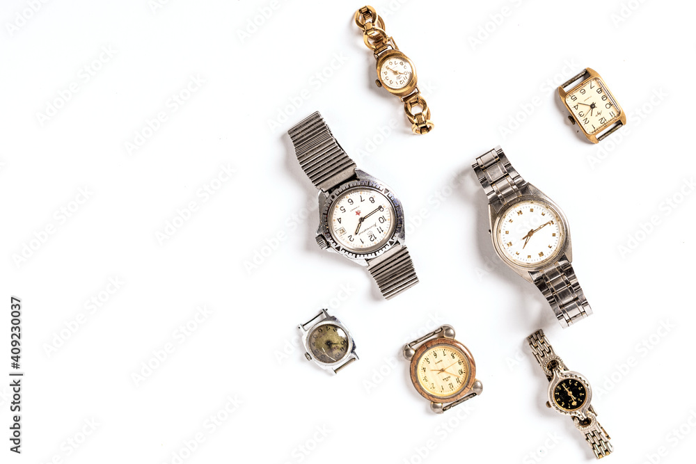 Pattern of different old wristwatches on white background