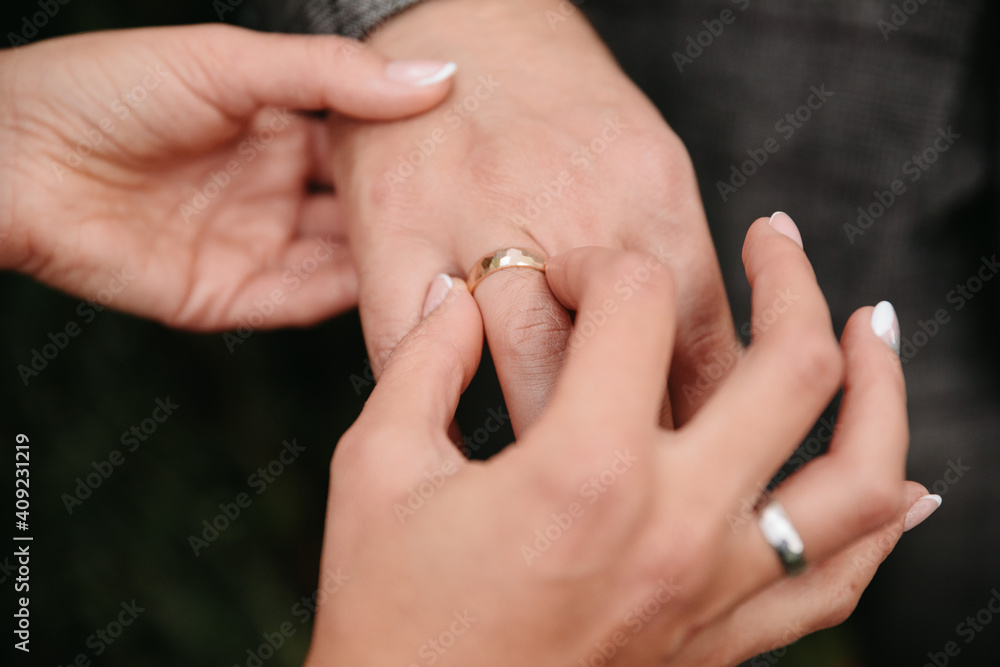 Holding hands with wedding rings. Bridal bouquet is held with bridal hands. Invitation to the wedding ceremony. Wedding rings. Flowers and shoes for the bride. Bridal shoes and jewellery Holding hands with wedding rings. Bridal bouquet is held with bridal hands. Invitation to the wedding ceremony. Wedding rings. Flowers and shoes for the bride. Bridal shoes and jewellery