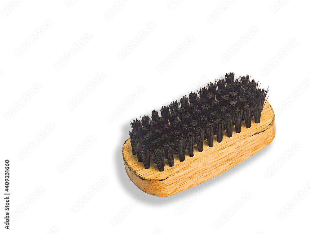 A clothes brush with a brown wooden handle ,Brush for footwear. on a white background