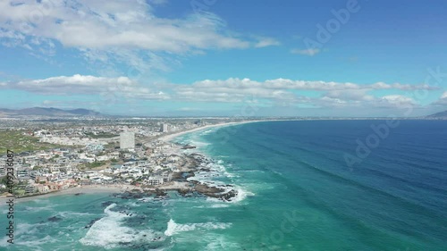 CAPE TOWN, SOUTH AFRICA - Aerial moving along the shoreline of Big Bay, Cape Town, South Africa.