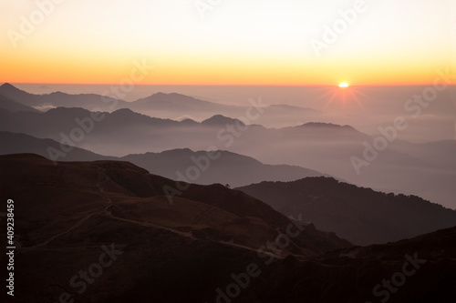 Sun rising up in mountains, Indian Himalayas