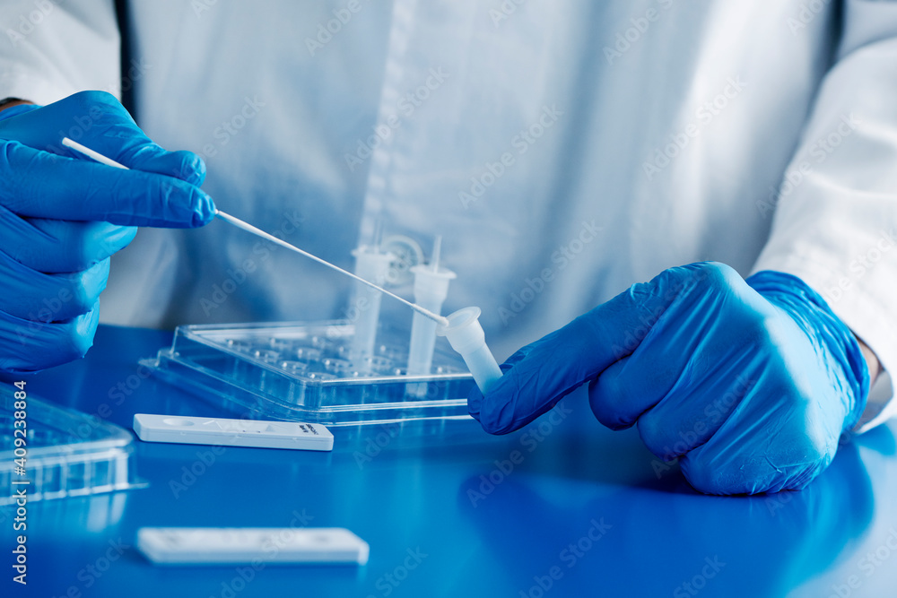healthcare worker using a covid-19 antigen test