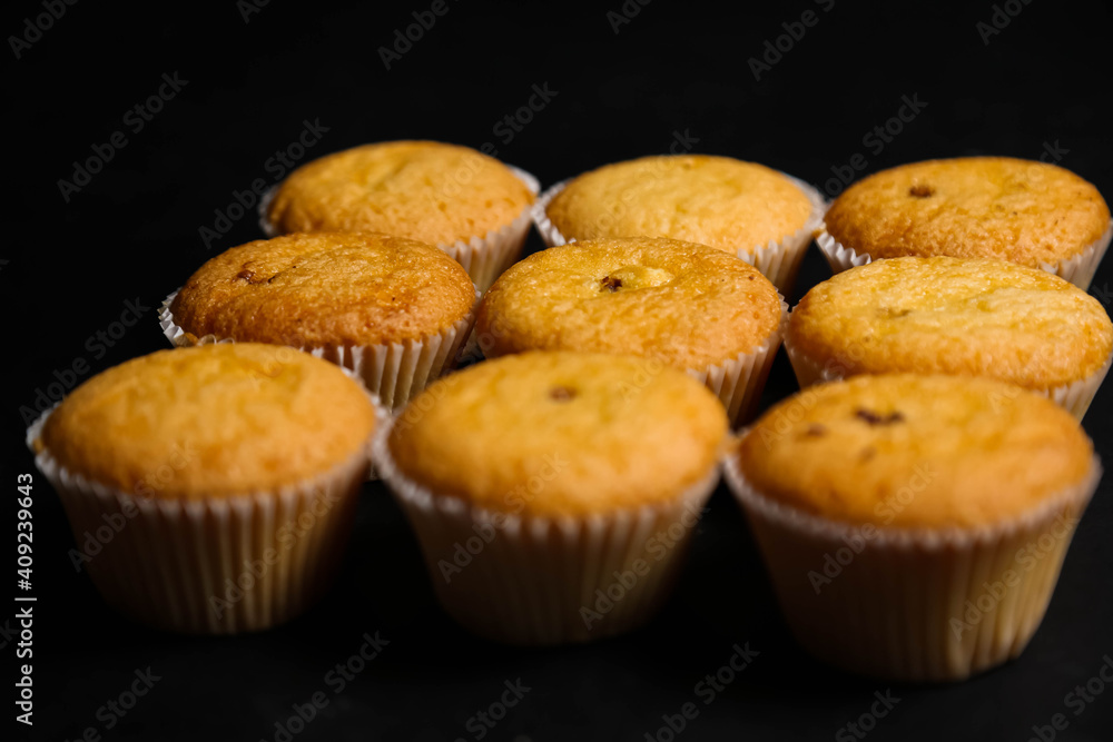 cupcakes on a black background. Baking cupcakes on a black background. Baking