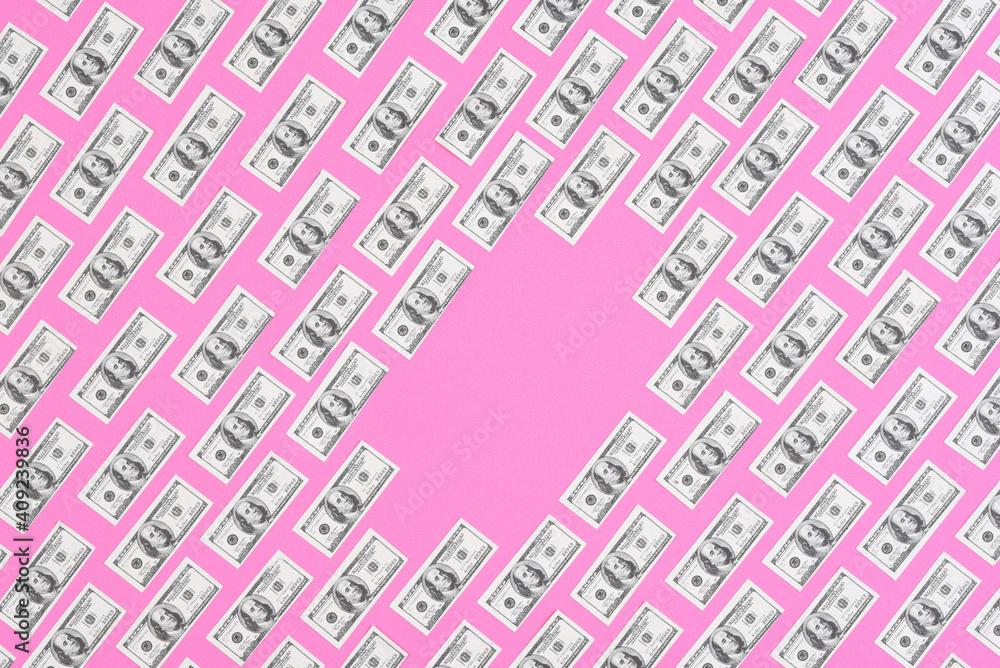 IRVINE, CALIFORNIA - 26 JAN 2021: Fake, mini USA 100 dollar bills arranged in rows on a pink background with blank space in the middle. Bills are not real currency, stage money. IRVINE, CALIFORNIA - 26 JAN 2021: Fake, mini USA 100 dollar bills arranged in rows on a pink background with blank space in the middle. Bills are not real currency, stage money.