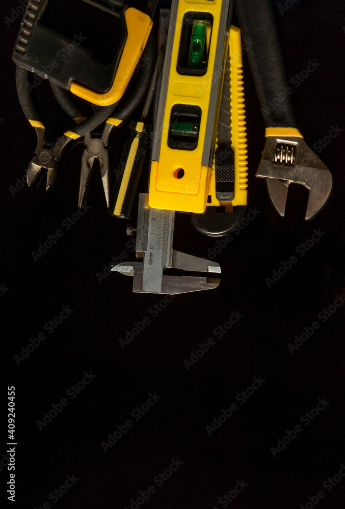 Tools for master builder on a isolated black background