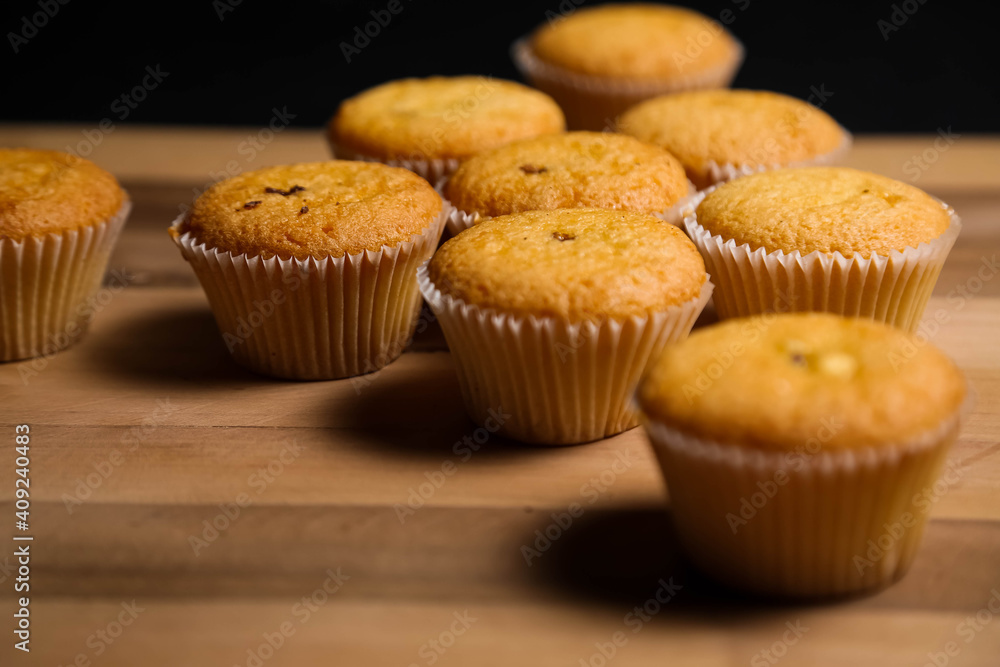 cupcakes on a wooden background. Baking cupcakes on a wooden background. Baking