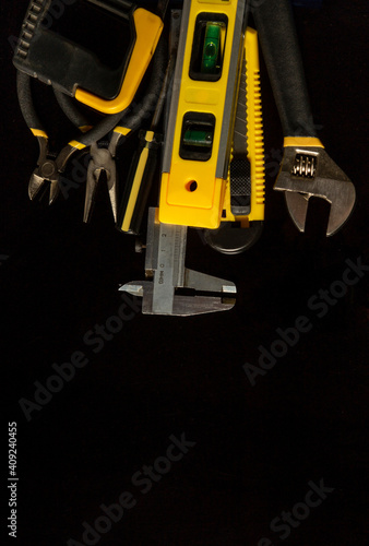 Tools for master builder on a isolated black background