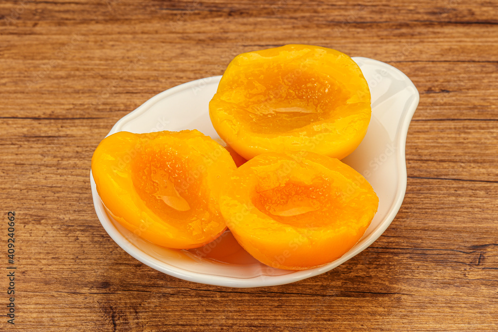 Marinated peaches fruit in the bowl