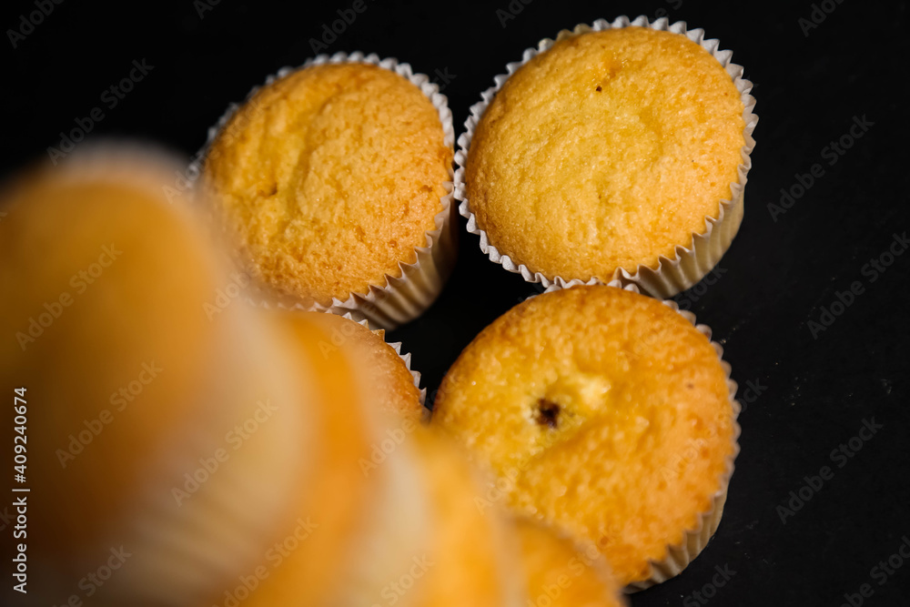 cupcakes on a black background. Baking cupcakes on a black background. Baking