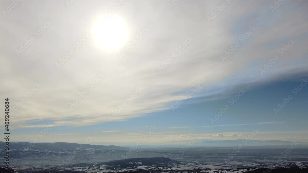 Sunny winter day and aerial view of city and mountains Sunny winter day and aerial view of city and mountains
