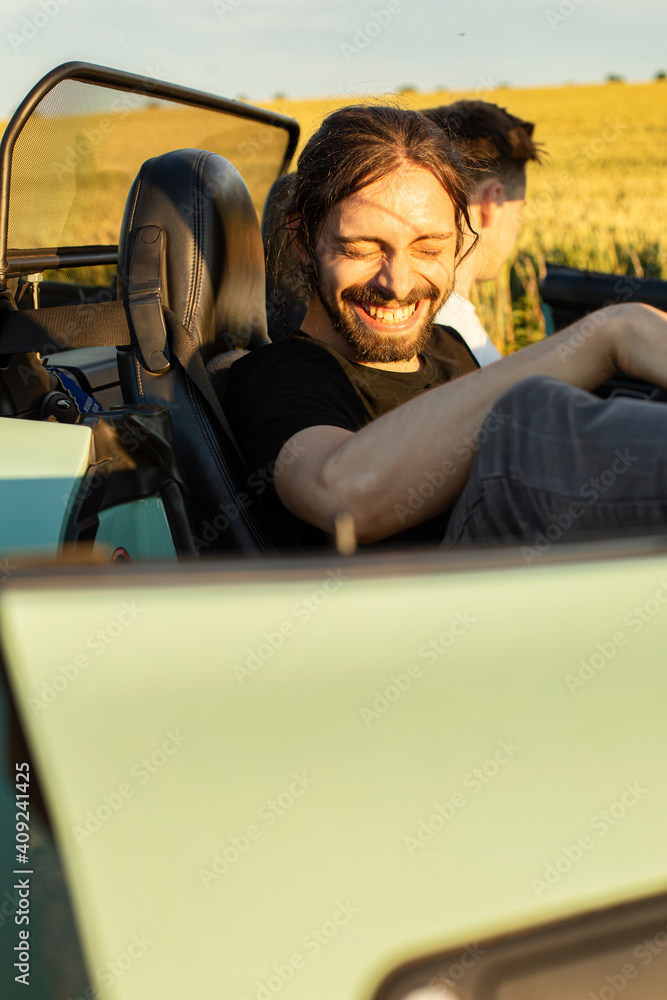 White european models men smiling in the car White european models men smiling in the car