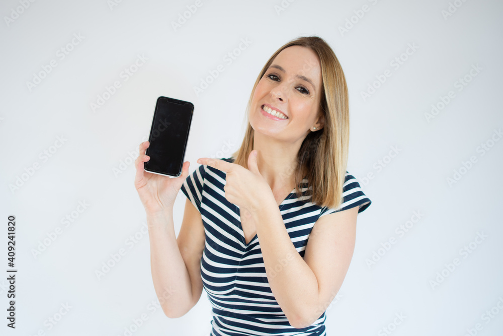Young happy cheerful woman showing mobile phone over white background. Young happy cheerful woman showing mobile phone over white background.