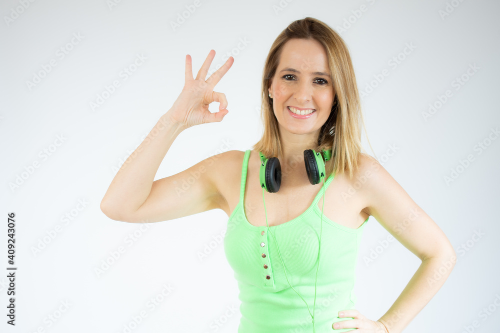 Happy young woman showing okay sign isolated over white background Happy young woman showing okay sign isolated over white background