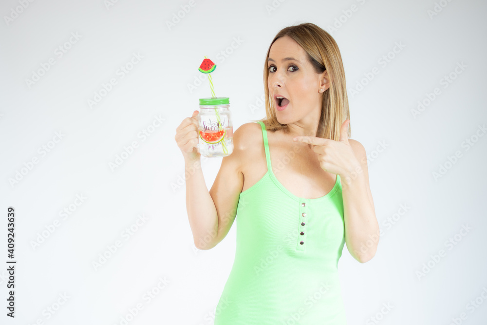 Portrait of gorgeous vacation woman smiling holding cold drink isolated over white background. Portrait of gorgeous vacation woman smiling holding cold drink isolated over white background.