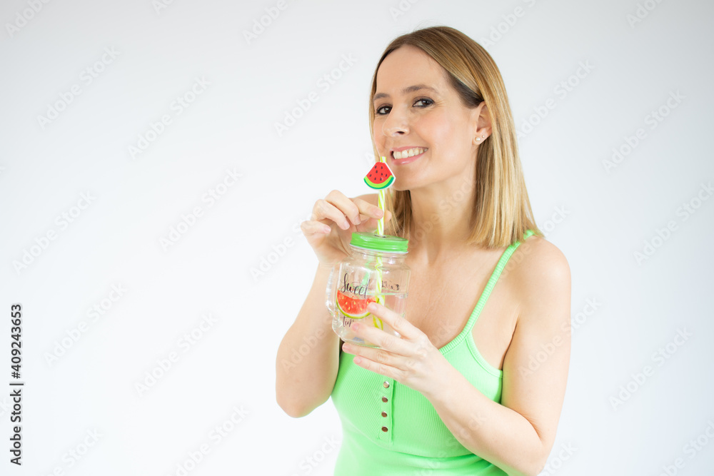 Portrait of gorgeous vacation woman smiling holding cold drink isolated over white background. Portrait of gorgeous vacation woman smiling holding cold drink isolated over white background.