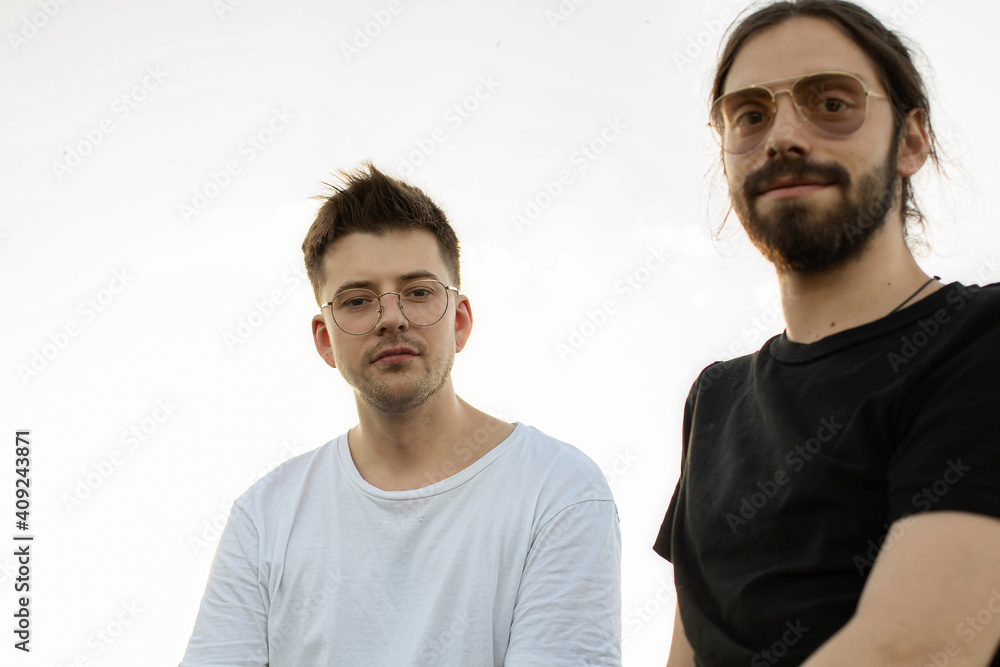 European young white men in sunglasses portrait on white European young white men in sunglasses portrait on white
