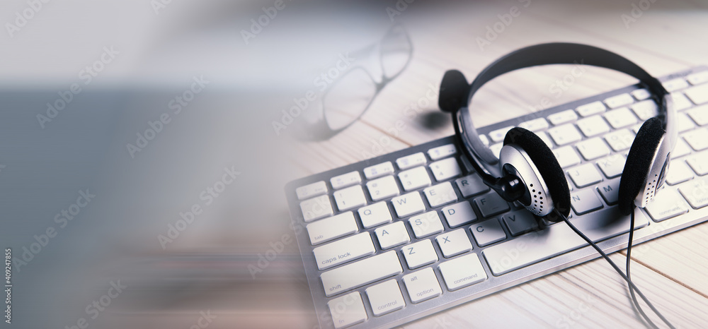 Headset on a laptop keyboard. Headset on a laptop keyboard.
