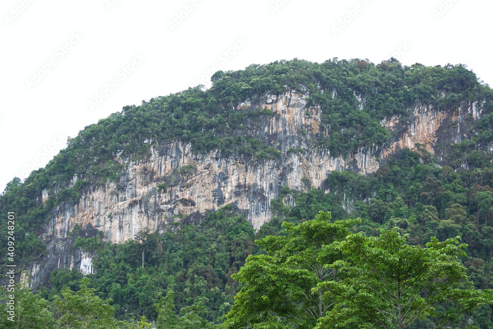 Limestone mountains with some steep cliffs that are vertical.