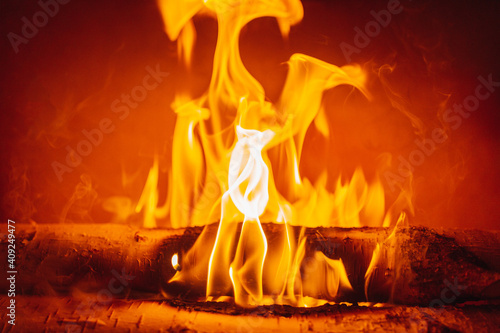Fireplace burning wood logs, cozy warm home