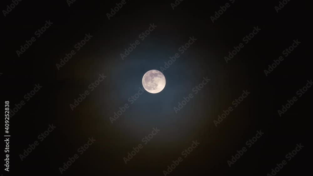 Full bright moon with fast moving clouds in front of it. Full bright moon with fast moving clouds in front of it.