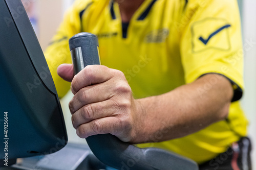 a patient pedals a bicycle during a cardiac rehabilitation program
