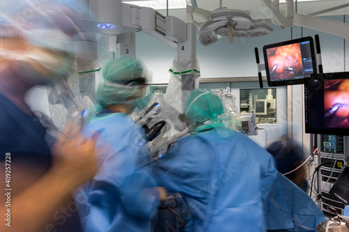 a group of surgeons are busy in the operating room photo
