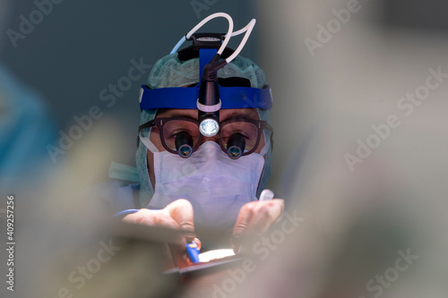 cardiac surgeon operating on a heart photo