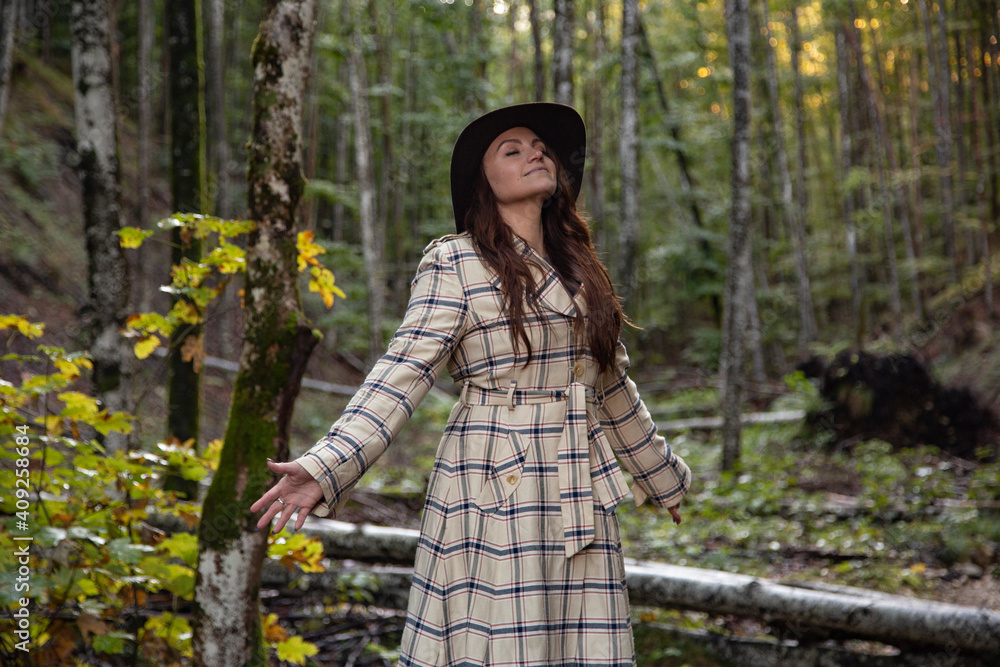 A pretty young woman feeling free in nature A pretty young woman feeling free in nature