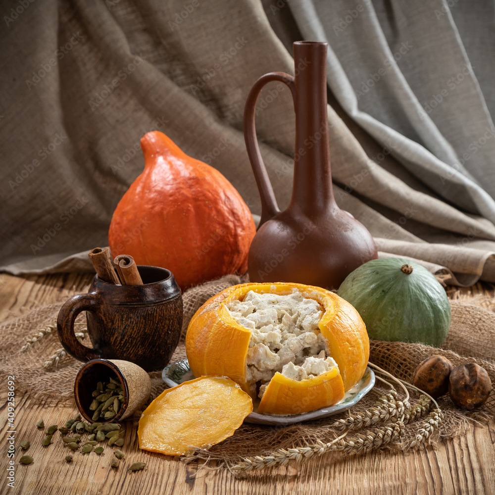 Still life with baked stuffed pumpkin