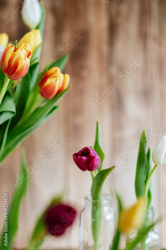 Fototapeta Naklejka Na Ścianę i Meble -  Colorful tulips with wooden background, spring flower still life